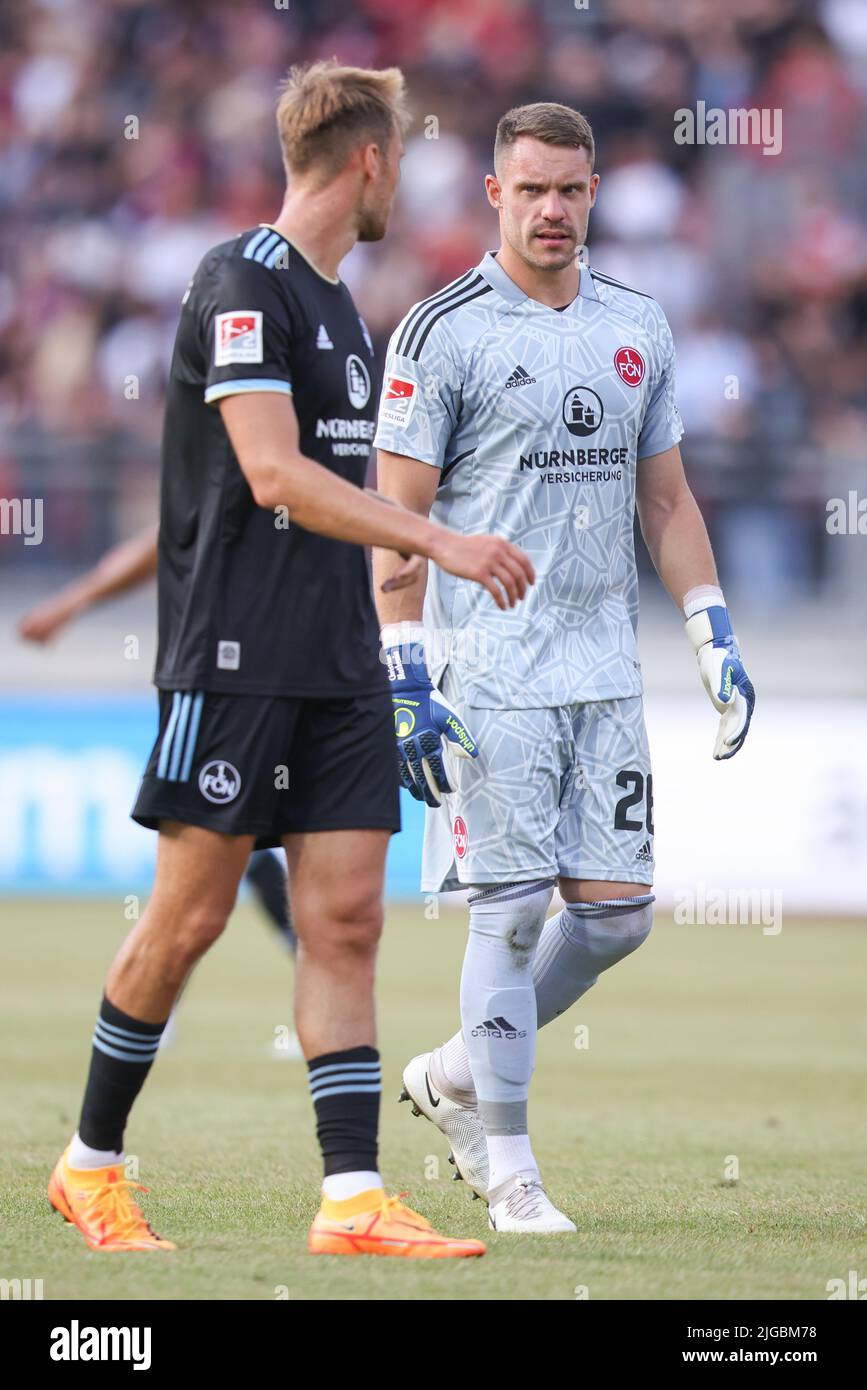 08 July 2022, Nuremberg: Soccer: Test matches, 1. FC Nuremberg - FC Arsenal at Max Morlock Stadium. Nuremberg goalkeeper Christian Mathenia (r) talks to his colleague Asger Sörensen. Photo: Daniel Karmann/dpa - IMPORTANT NOTE: In accordance with the requirements of the DFL Deutsche Fußball Liga and the DFB Deutscher Fußball-Bund, it is prohibited to use or have used photographs taken in the stadium and/or of the match in the form of sequence pictures and/or video-like photo series. Stock Photo