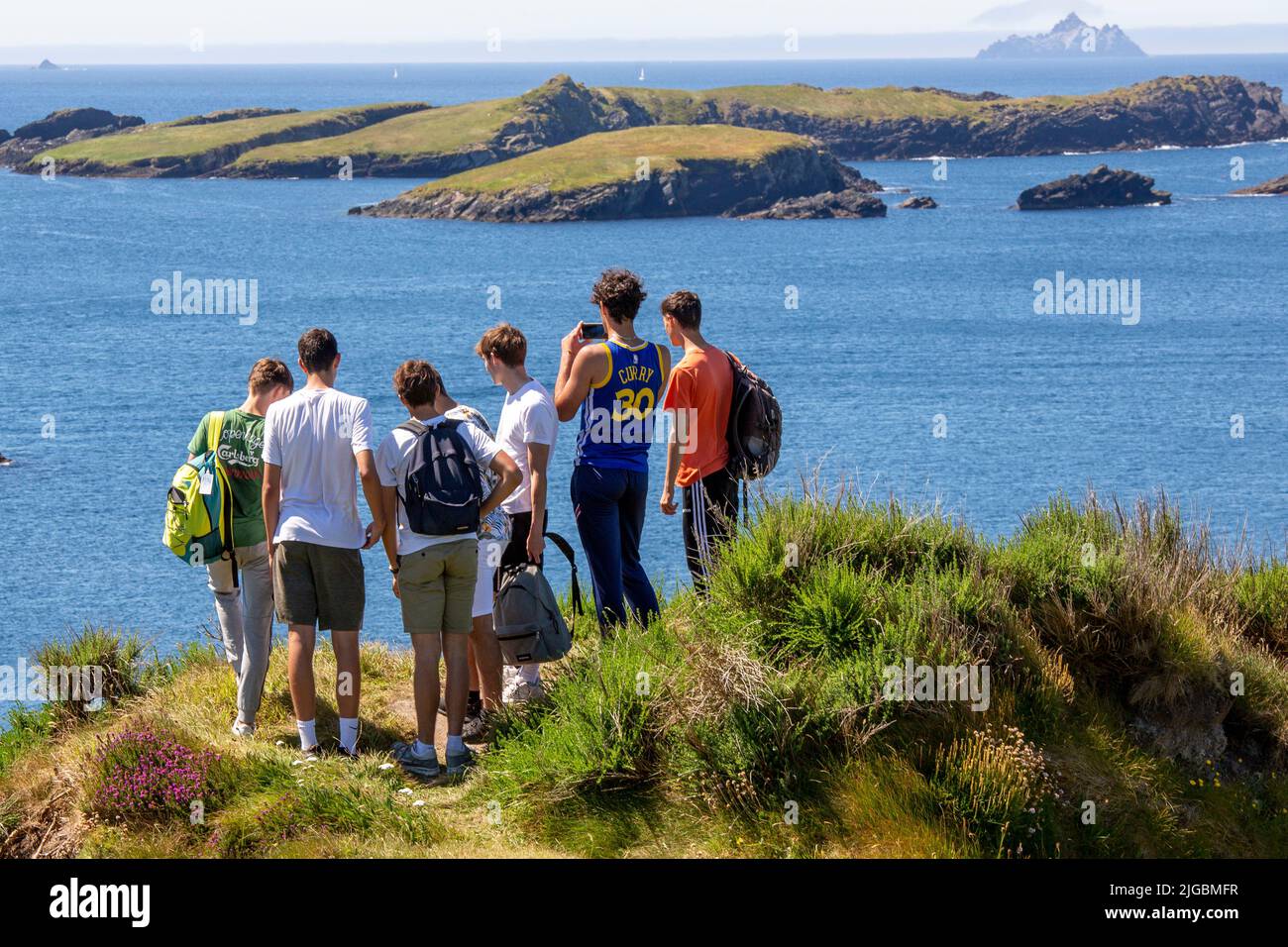 Group of young tourists sightseeing on Valentia Island, County Kerry, Ireland Stock Photo