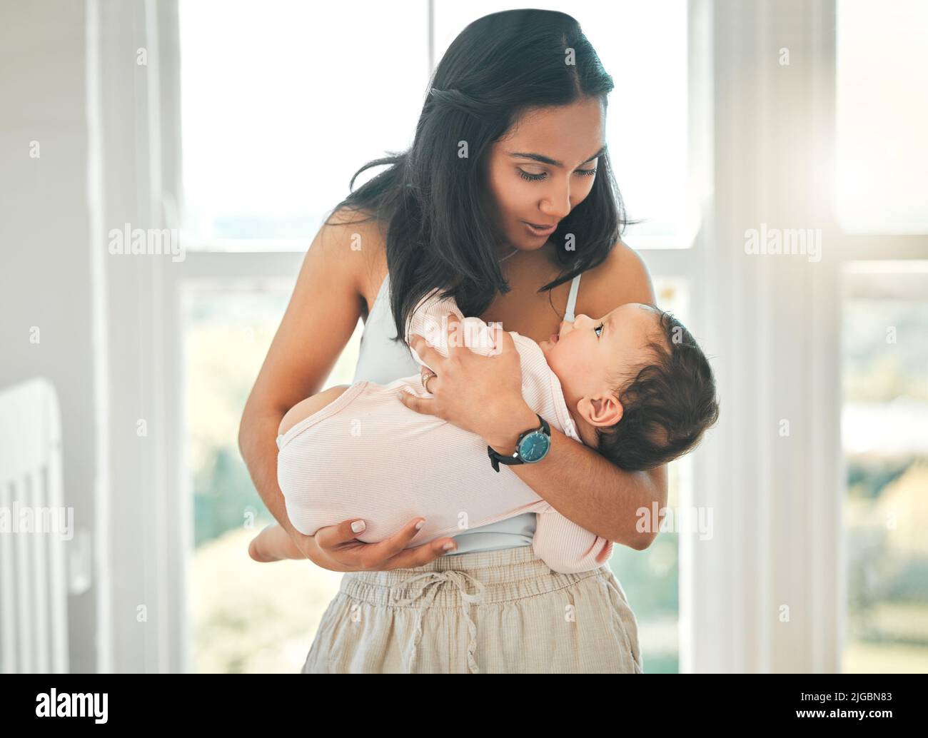 Her whole world. an attractive young woman and her newborn baby at home. Stock Photo