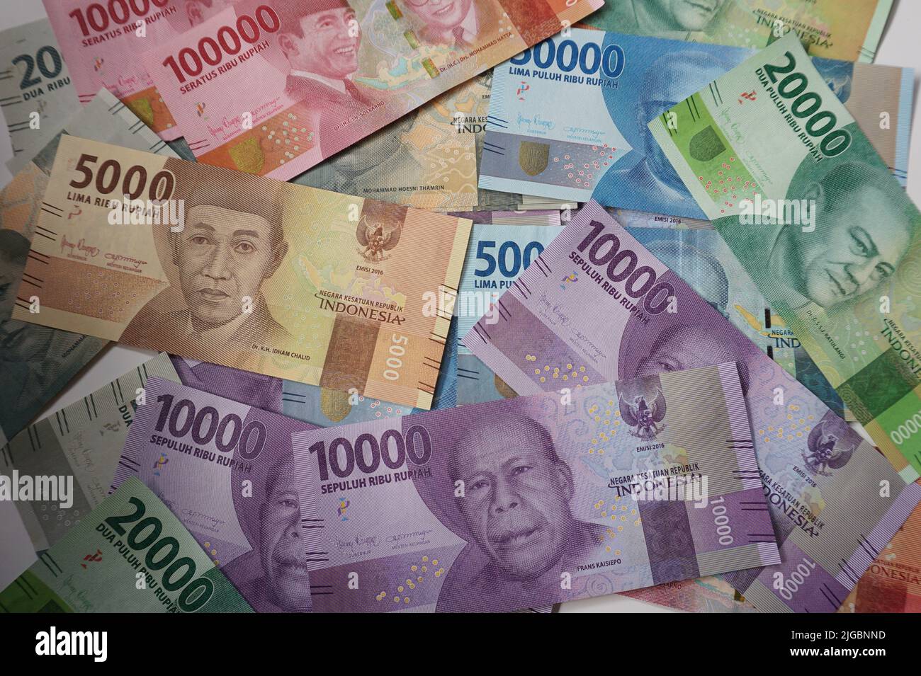 Indonesian Rupiah currency notes in various denomination on the white background. Officially from Bank Indonesia. Stock Photo