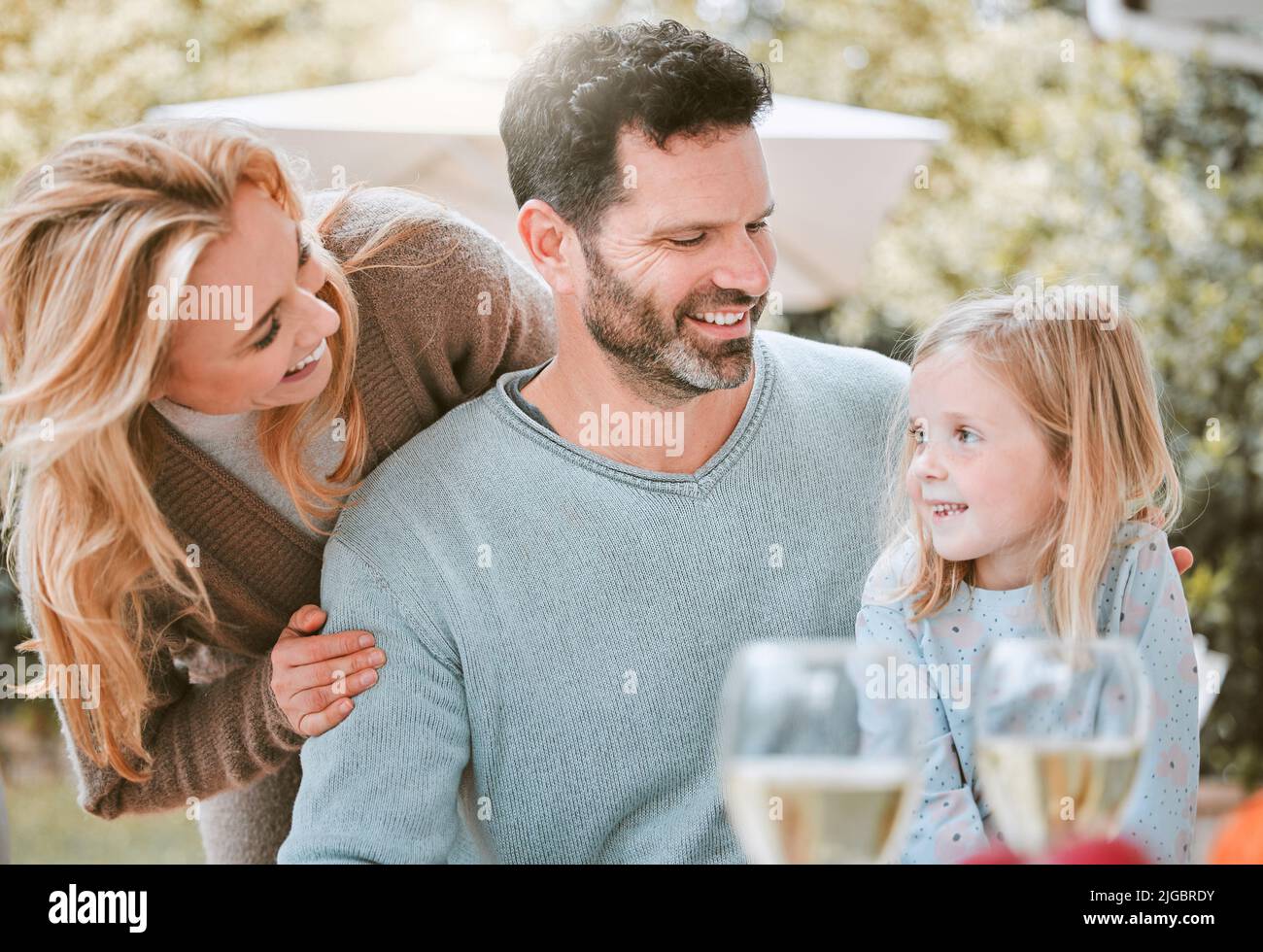 Happiness is having a close knit family. a little girl and her parents