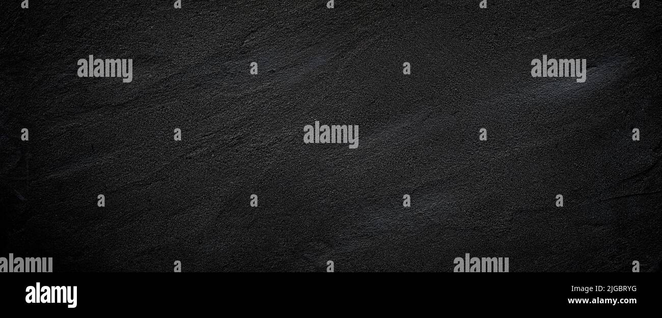 Black or dark gray rough grainy stone or sand texture background Stock ...