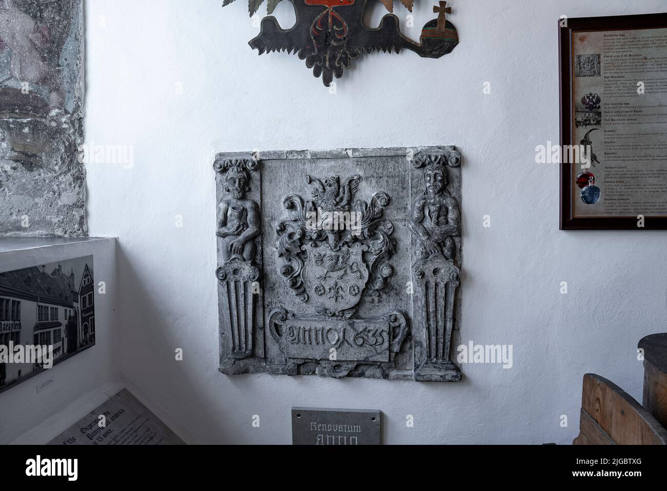 Carved structure with photographs and frames at old pharmacy museum in historic town Stock Photo