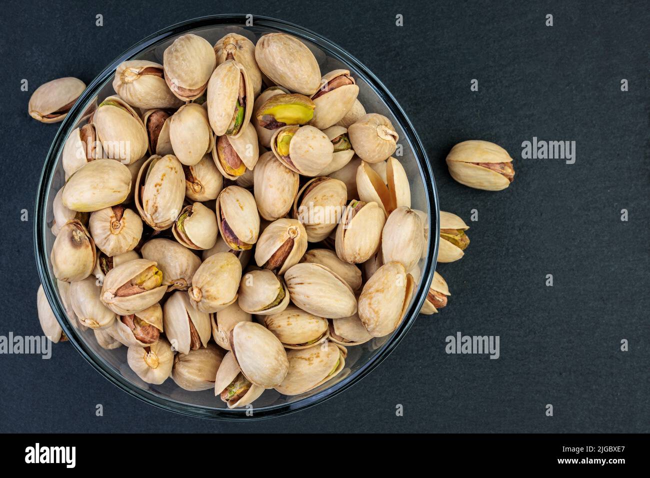 Pistachios in a glass bowl. Stock Photo