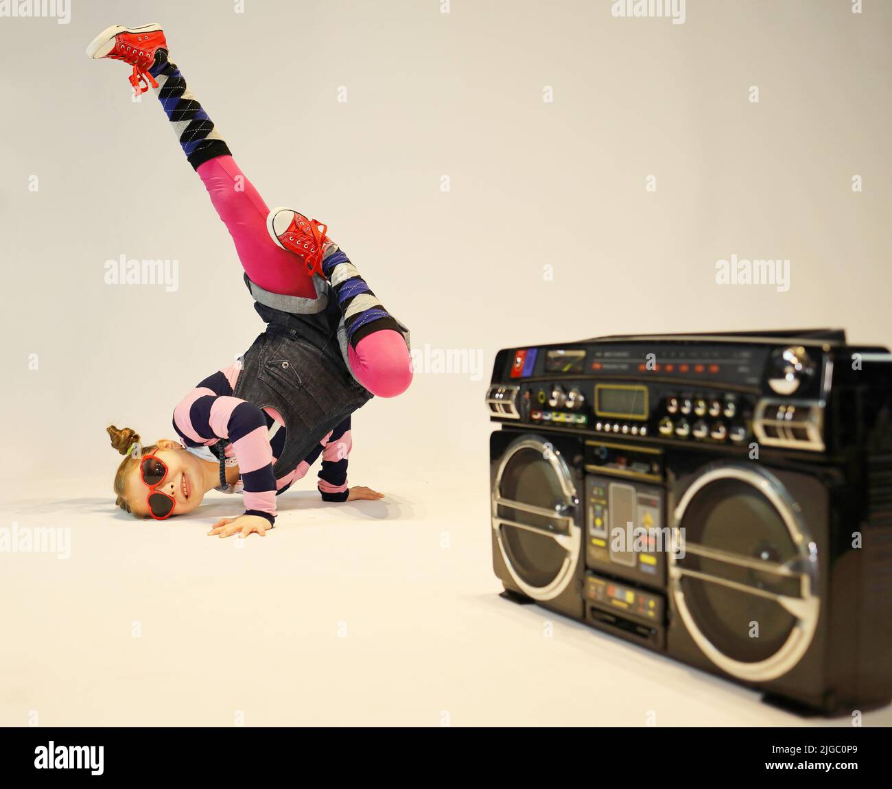 little girl in a difficult breakdance position with a boombox Stock ...