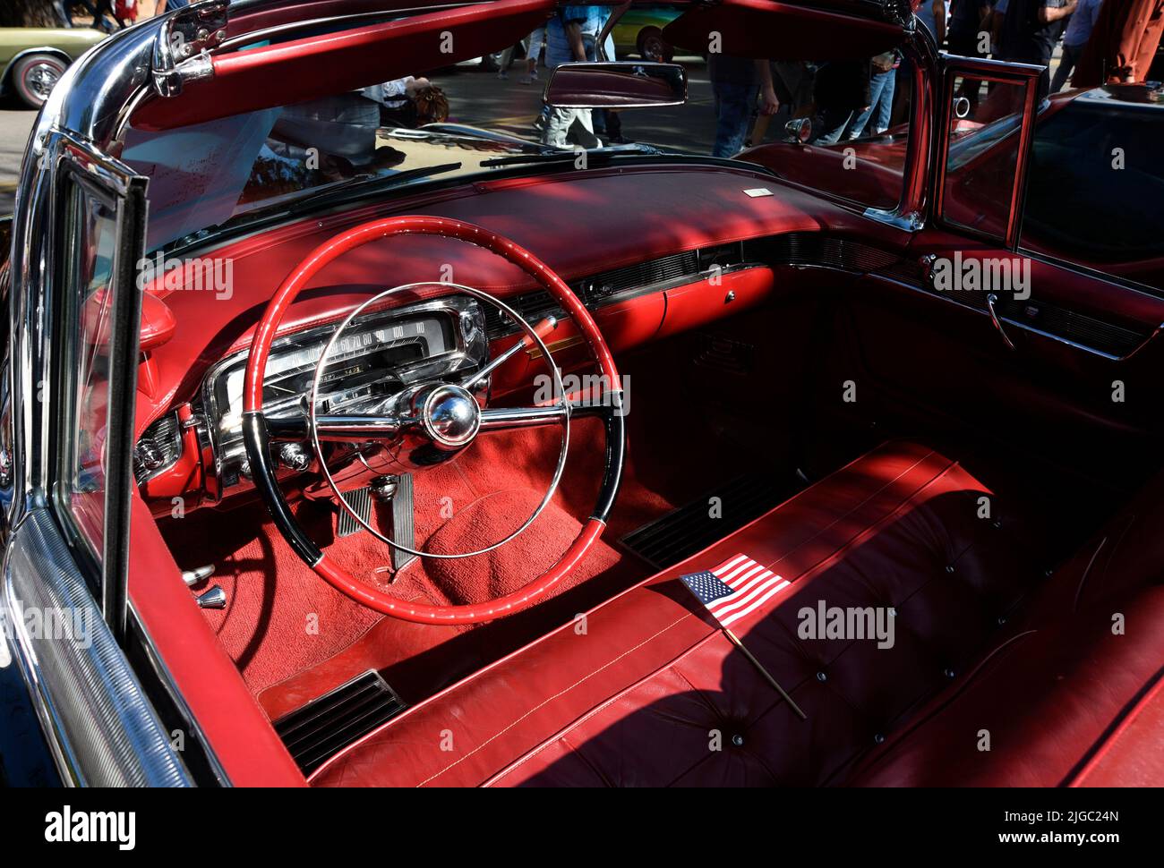 The steering wheel and dash of a 1955 Cadillac El Dorado on display at