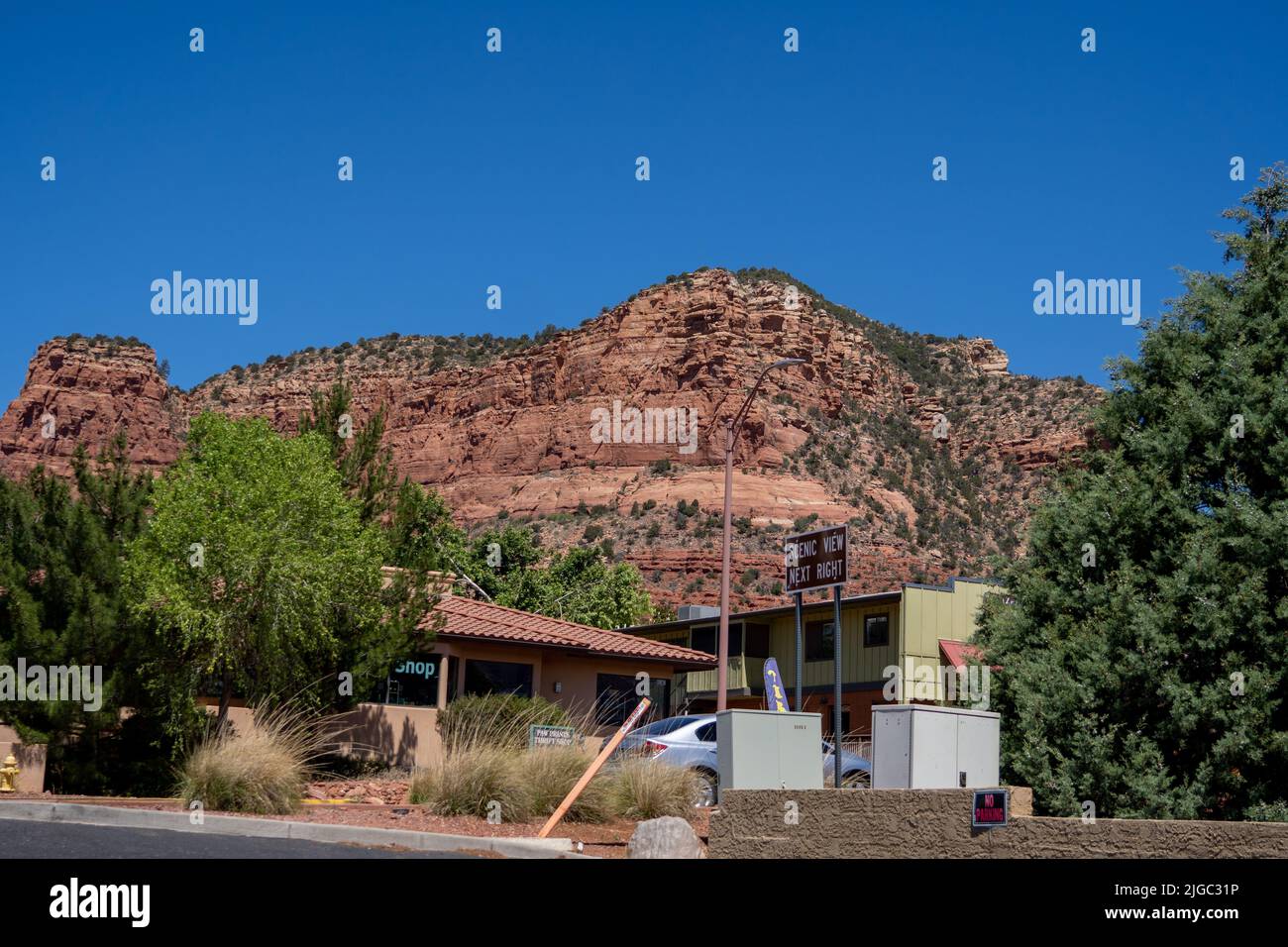 View of Sedona red cliffs from Circle K gas station near main street