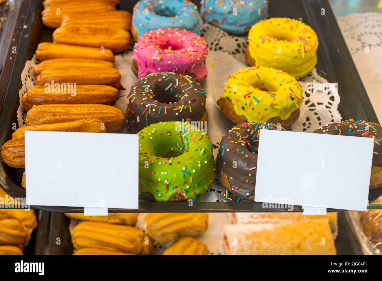 Confectionery, custard cake with condensed milk and donuts are on