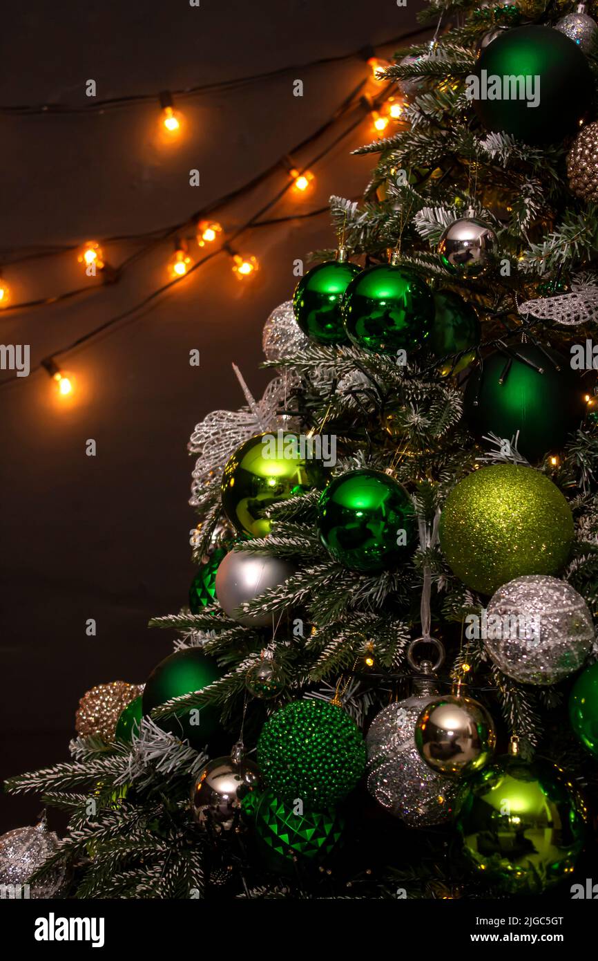 Modern design Christmas tree decorated with balls and garlands. Winter ...