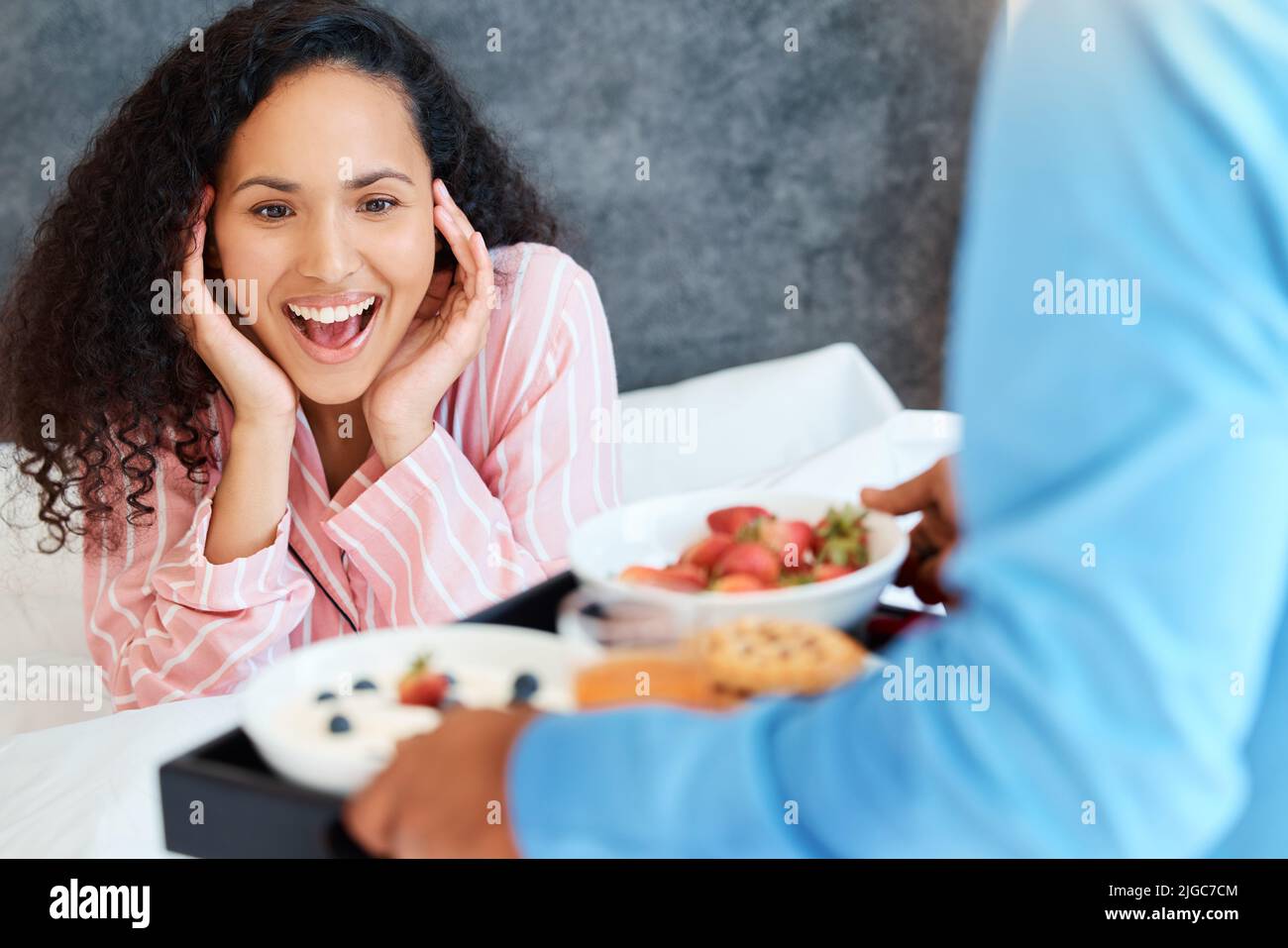 You shouldnt have. an attractive young woman getting served breakfast