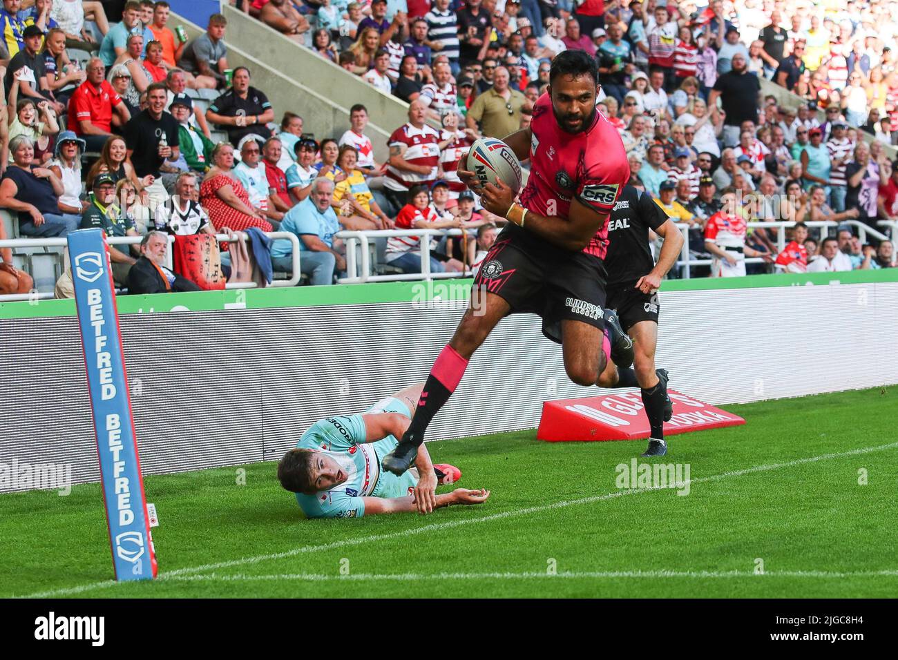 Expandable Try Line Bevan French #1 of Wigan Warriors gets past Jack Welsby #1 of St Helens ...
