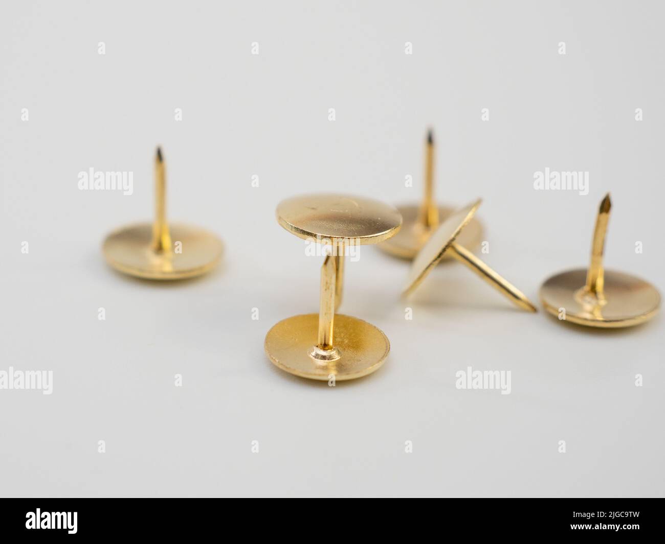 Gold thumbtacks hi-res stock photography and images - Alamy