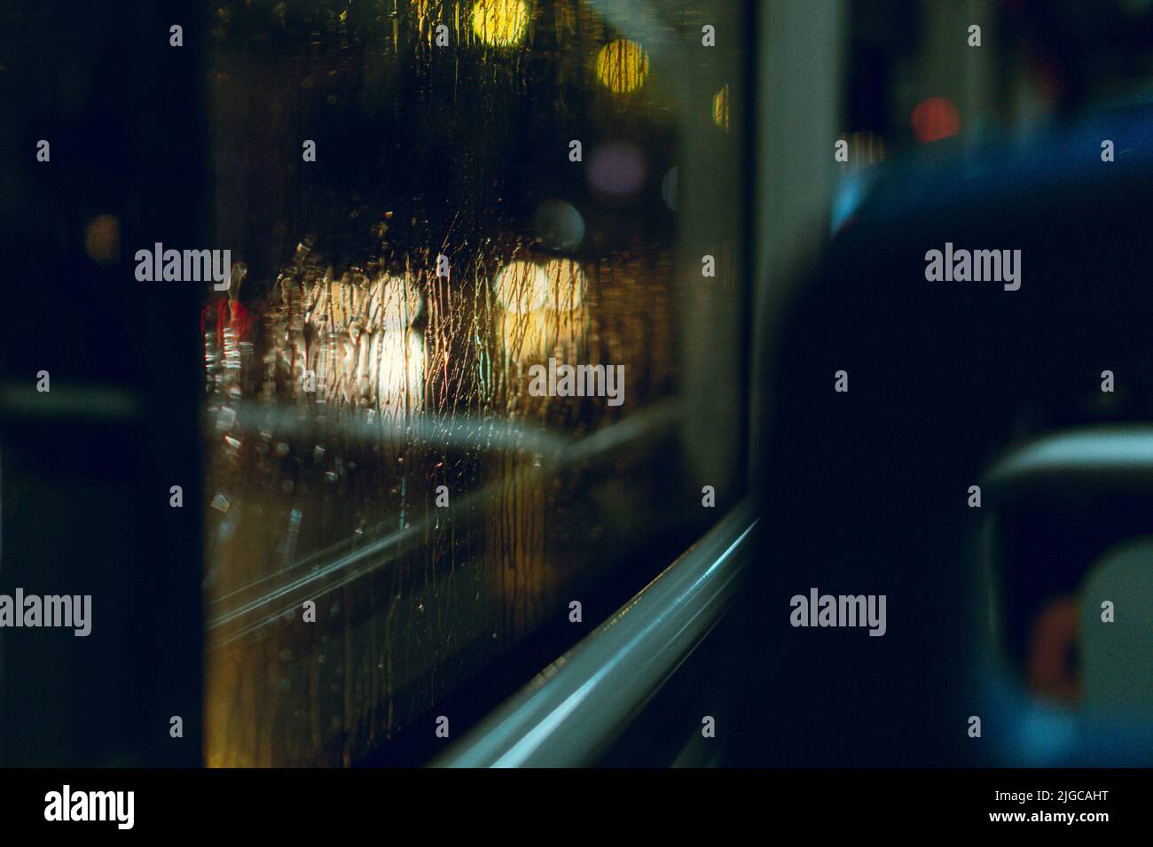 An inside of a bus with a view of a window and raindrops Stock Photo ...