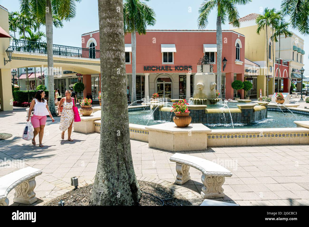Estero Florida,Miromar Outlet factory outlets designer name brand shopping mall fountain Michael Kors women adults Stock Photo