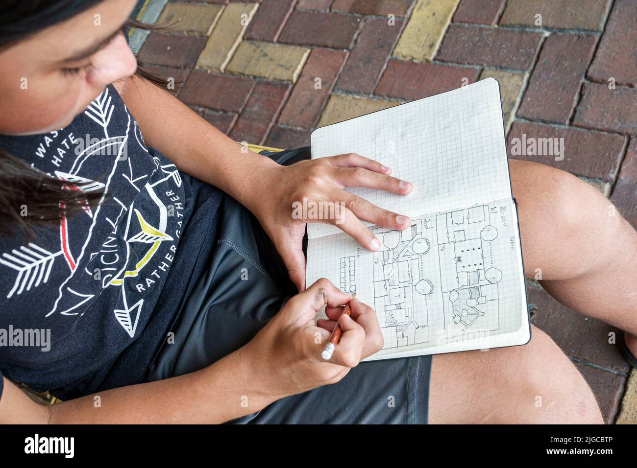 Punta Gorda Florida,adolescent boy sketching drawing map Stock Photo