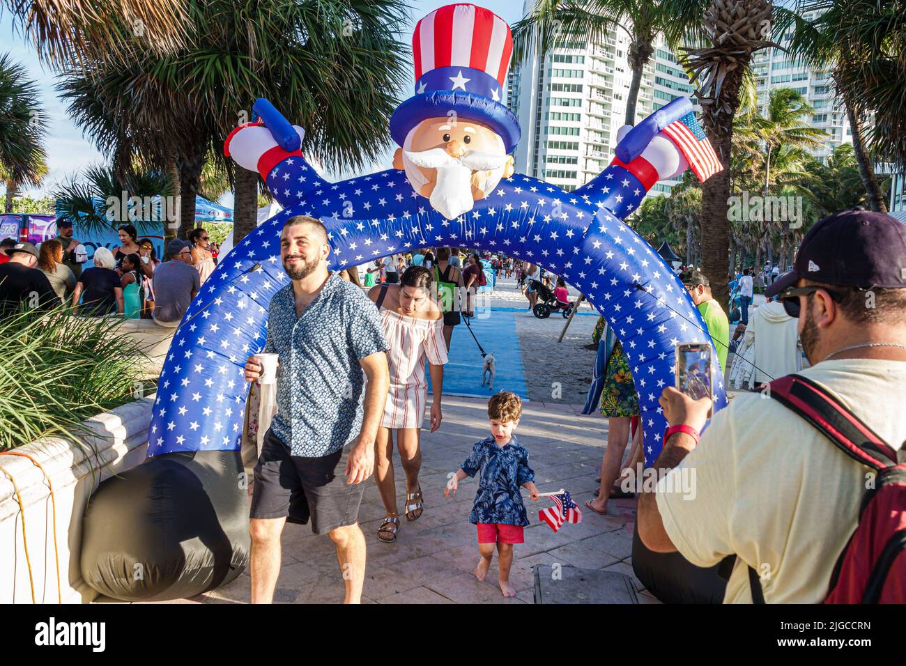 Miami Beach Florida,Ocean Terrace Fire on the Fourth 4th of July Festival event celebration,Uncle Sam arch archway Hispanic family father son mother Stock Photo