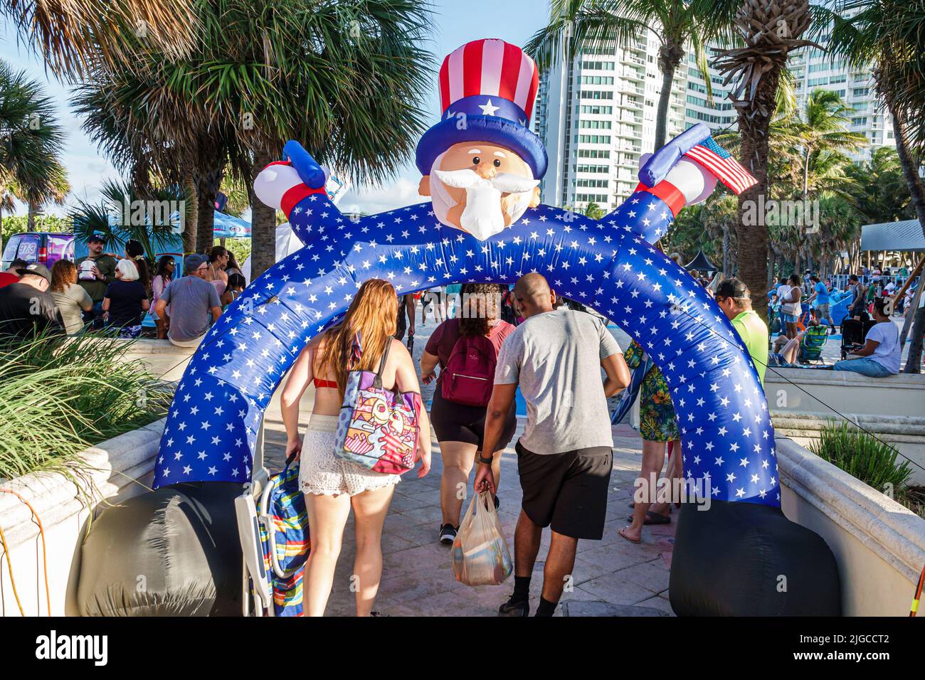 Miami Beach Florida,Ocean Terrace Fire on the Fourth 4th of July Festival event celebration,Uncle Sam arch archway man woman couple Hispanic Stock Photo