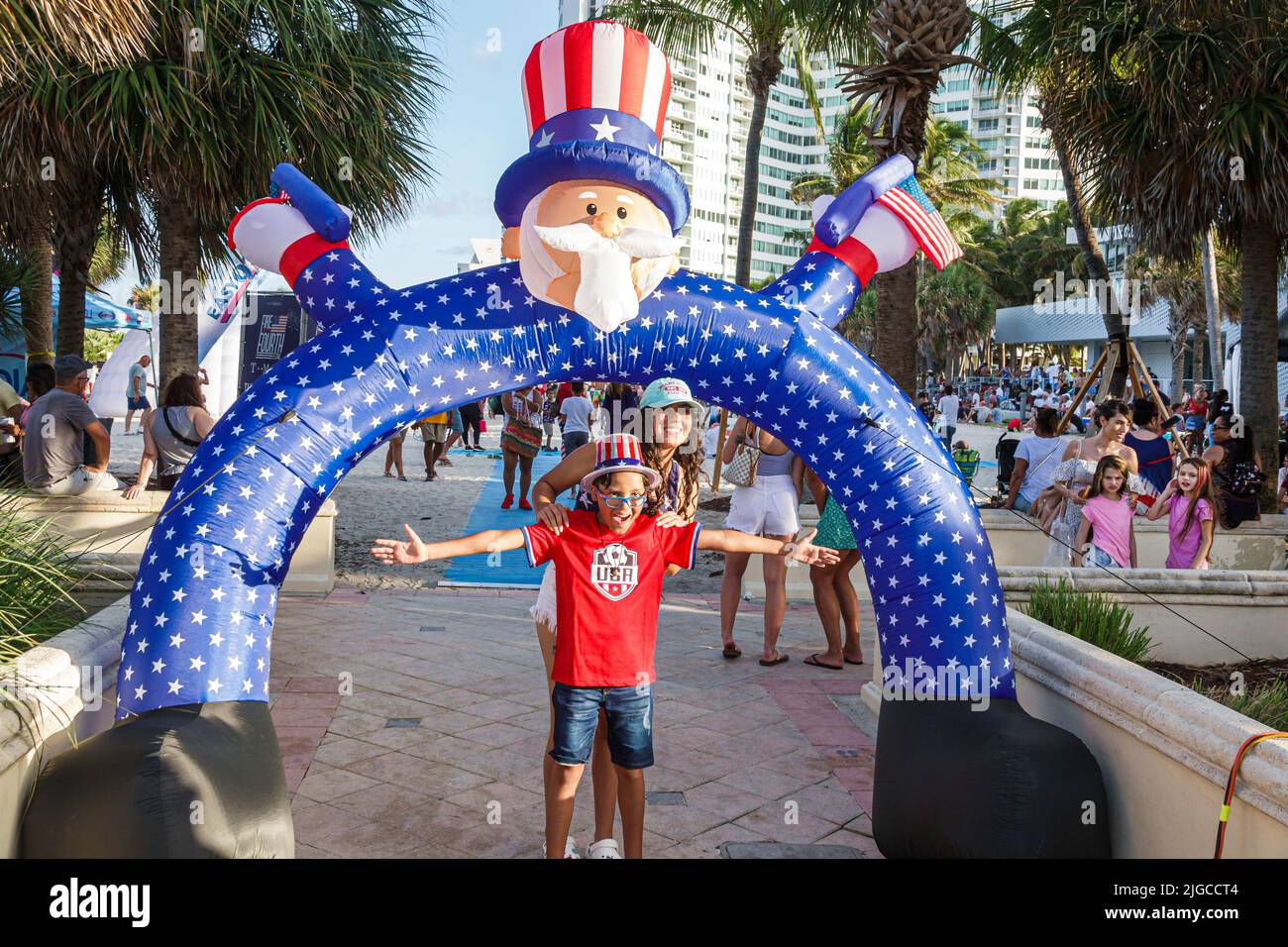 Miami Beach Florida,Ocean Terrace Fire on the Fourth 4th of July Festival event celebration,Uncle Sam arch archway Hispanic boy older sister posing Stock Photo