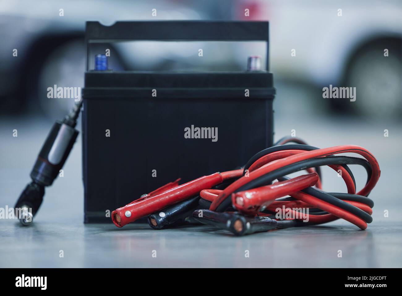 No car can run without it. a leadacid battery on the floor of a car