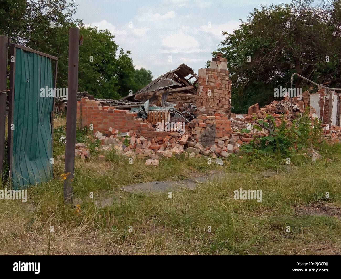 Destroyed house and a consequence of the bombing. Kyiv region, Ukraine Stock Photo
