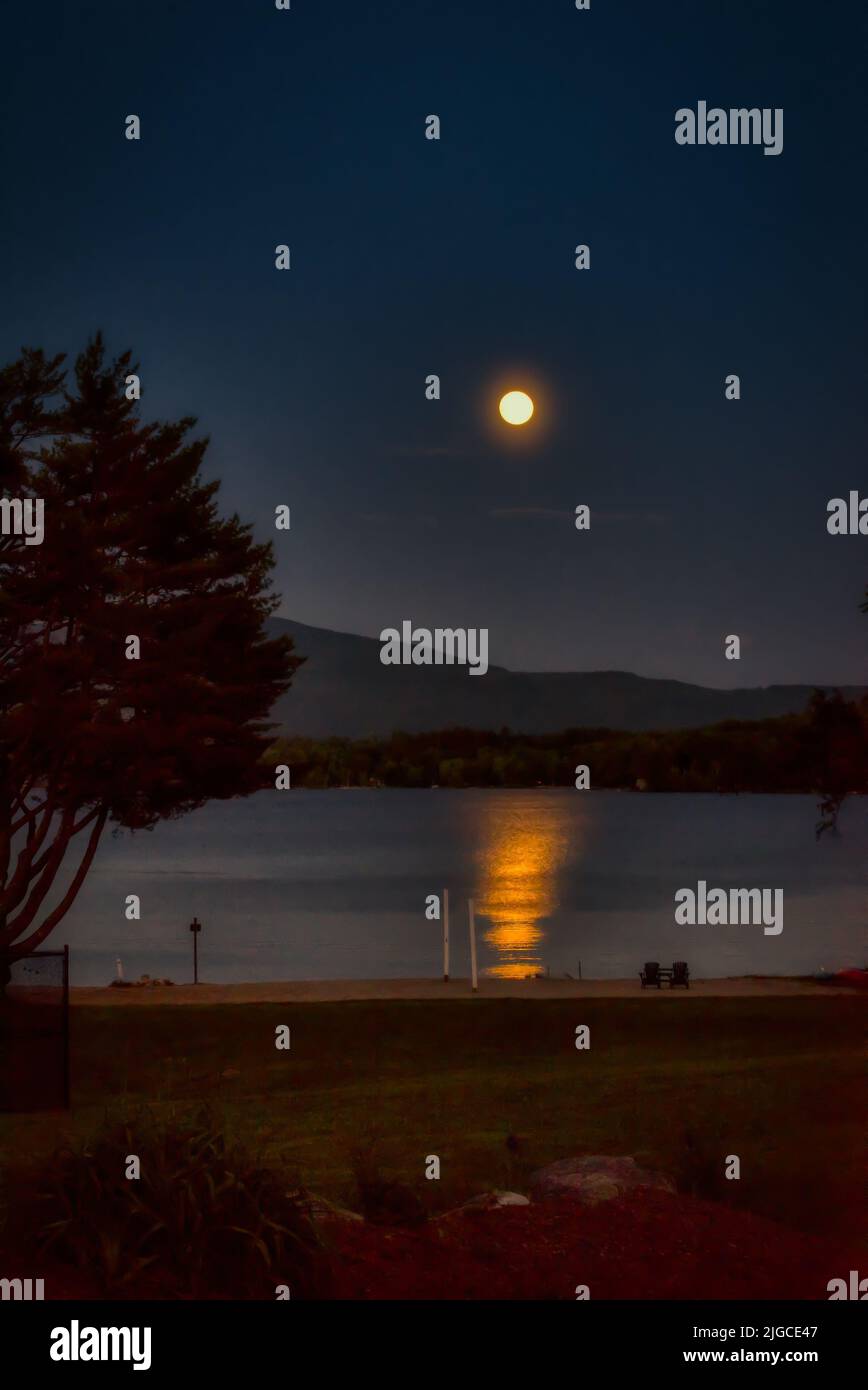 Full moon rising over Mt. Kersarge, Pleasant Lake, New London, NH. Site