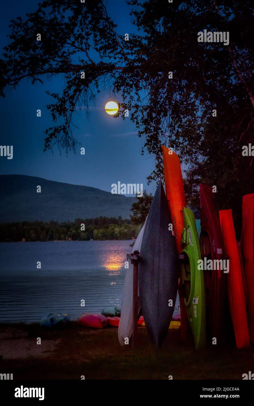 Full moon rising over Mt. Kersarge, Pleasant Lake, New London, NH. Site