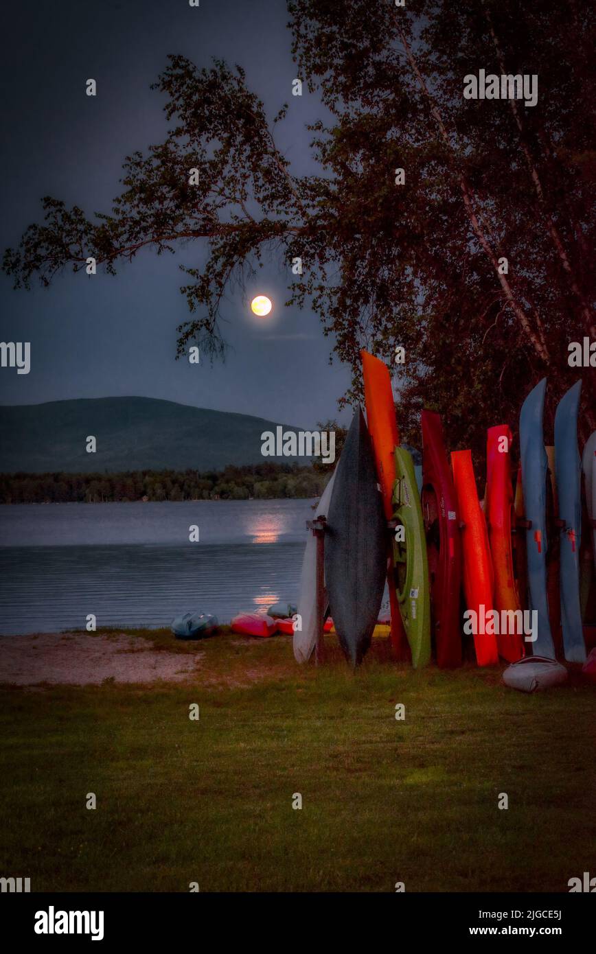 Full moon rising over Mt. Kersarge, Pleasant Lake, New London, NH. Site