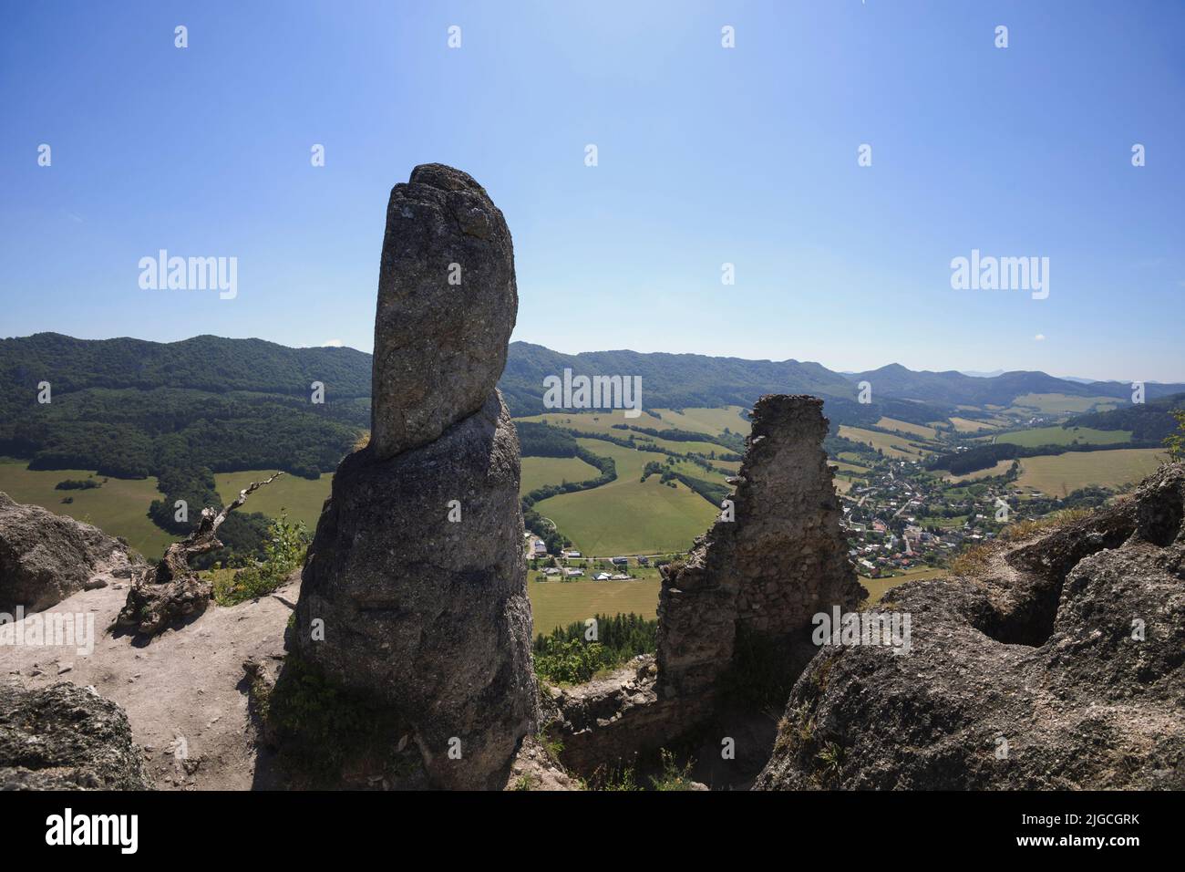 Sulovsky hrad, Sulov Casttle, Slovakia - ruins and remains of old historical building on the top of rock. Landscape with mountains and hills. Wide ang Stock Photo