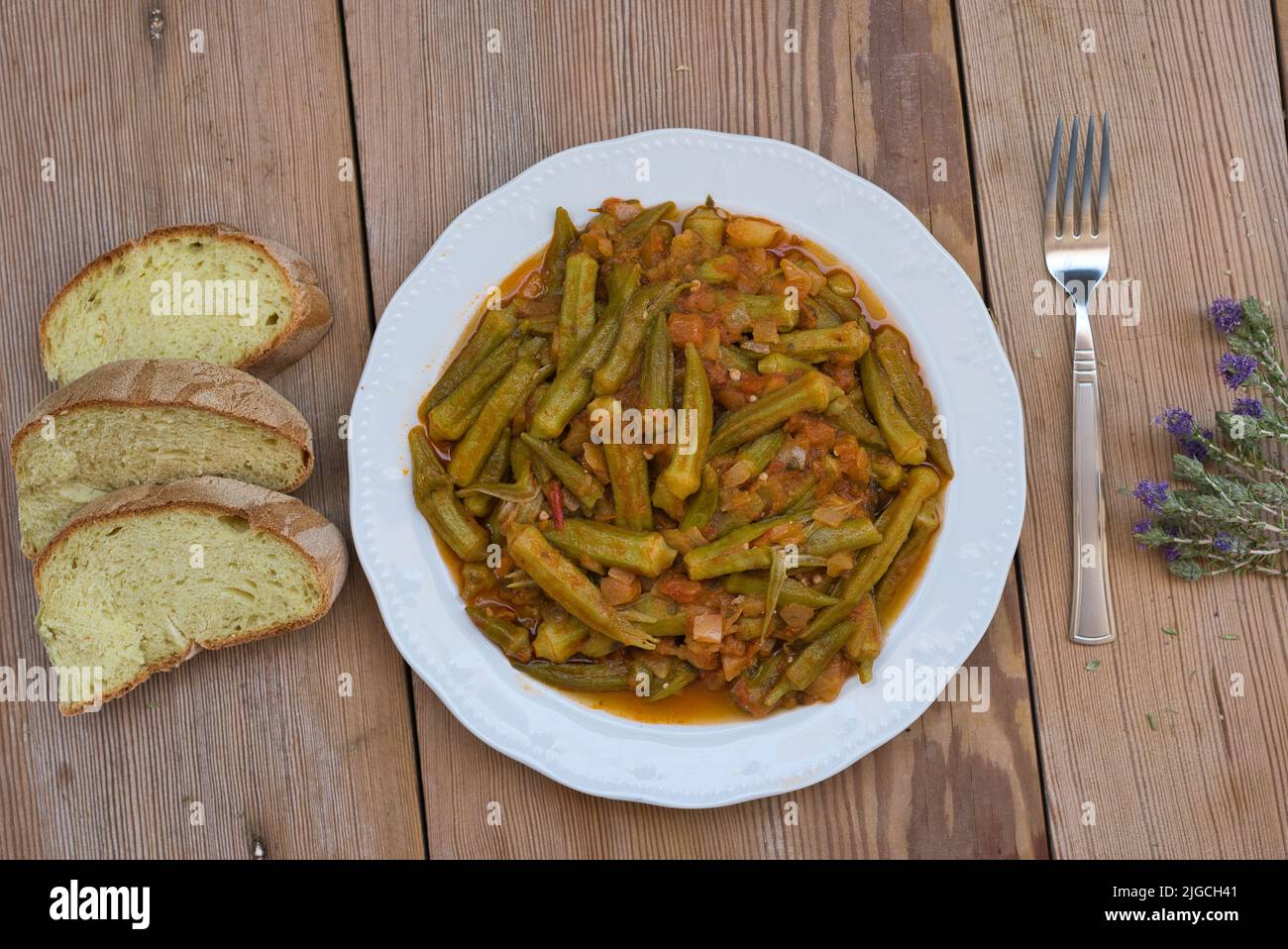 Okra in the pot, favorite traditional Greek food Stock Photo Alamy