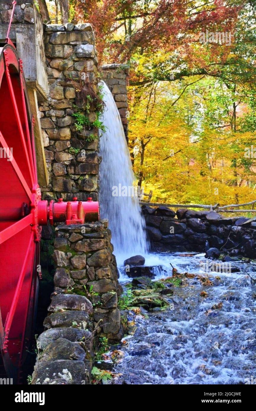 The Grist Mill Waterfall and Waterwheel in Autumn Stock Photo