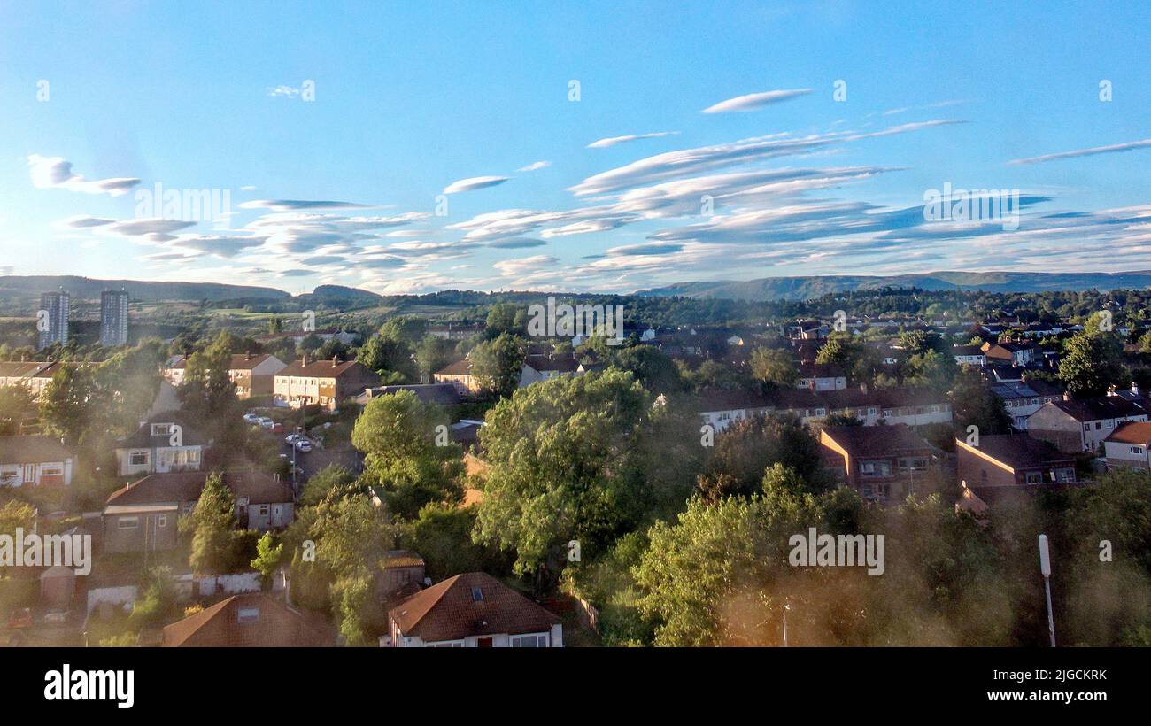 Glasgow, Scotland, UK 9th July, 2022.Spectacular UFO cloud invasion from loch lomond direction over bearsden towards the city as the lenticular clouds formed over hills and responsible for many spacecraft sightings appeared in the northern sky. Credit Gerard Ferry/Alamy Live News Stock Photo