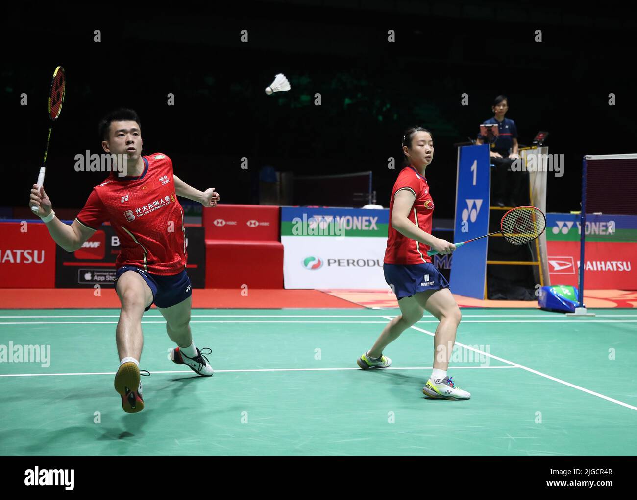 Zheng Si Wei (L) and Huang Ya Qiong of China compete against Yang Po Hsuan of Taiwan during the Mixed Doubles semi-finals match of the Perodua Malaysia Masters 2022 at Axiata Arena,