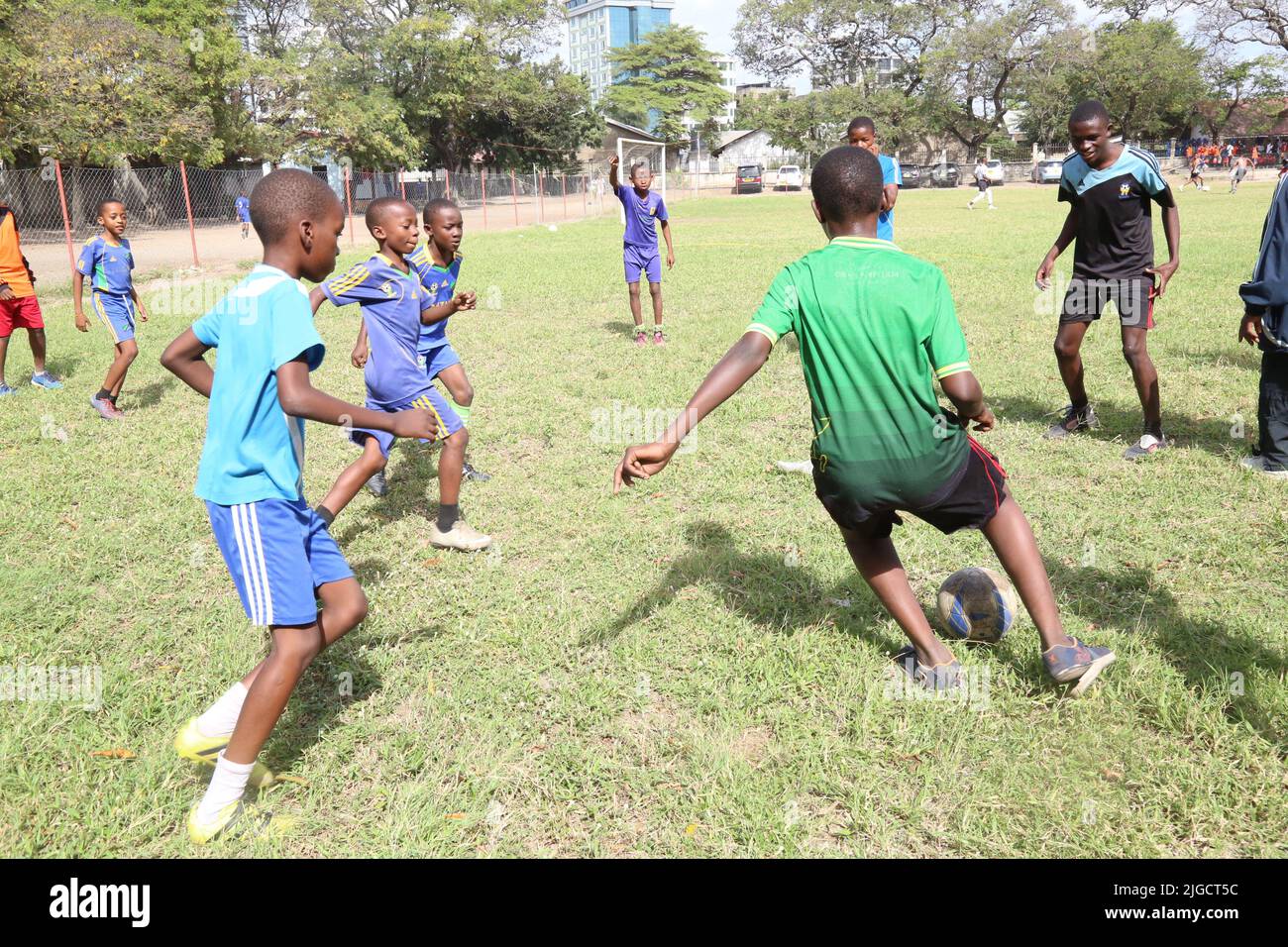 Dar Es Salaam, Tanzania. 9th July, 2022. Students play football at Benjamin Mkapa Secondary School in Dar es Salaam, Tanzania, on July 9, 2022. Tanzanian parliament deputy speaker, Mussa Azzan Zungu, on Saturday thanked the Chinese Embassy in Tanzania for the renovation of a football ground and dressing rooms at the Benjamin Mkapa Secondary School. Credit: Herman Emmanuel/Xinhua/Alamy Live News Stock Photo