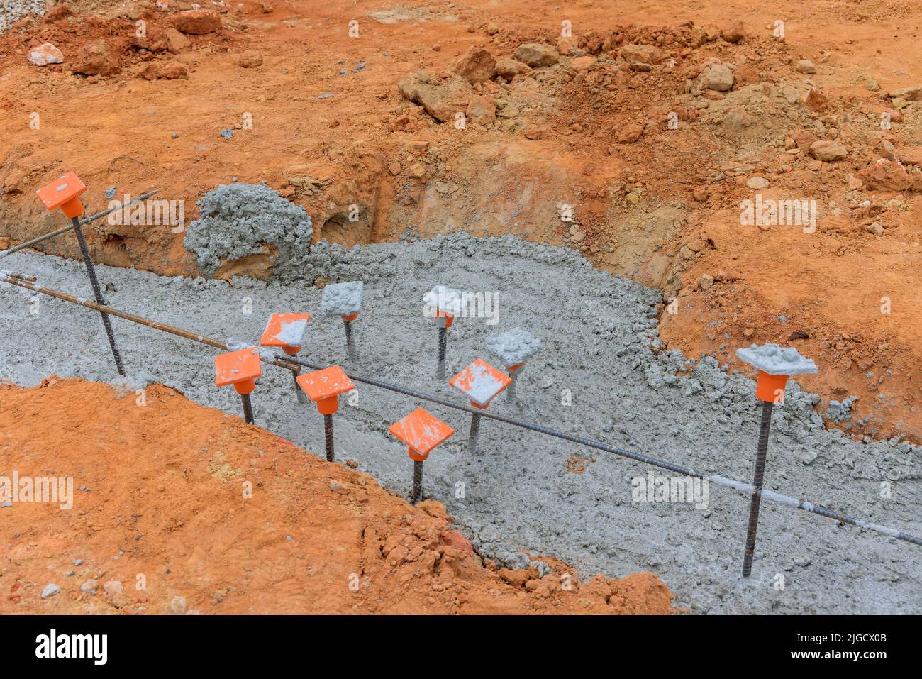 Adding a strip foundation reinforcement frame to a reinforced concrete building Stock Photo