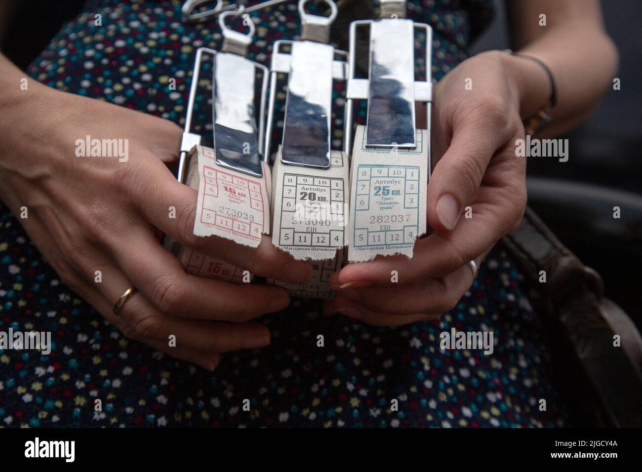 A bus conductor holds Soviet-style tickets for traveling on a bus in Moscow, Russia Stock Photo