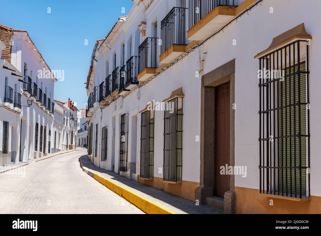 Street with old houses in the town of Valencia del Ventoso. Stock Photo