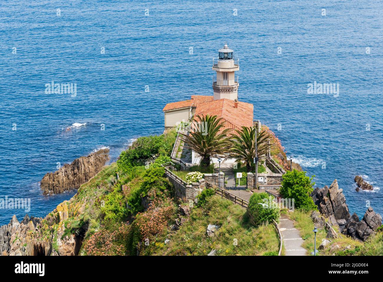 Cudillero Lighthouse, in Punta Roballera, overlooking the Cantabrian Sea. Stock Photo