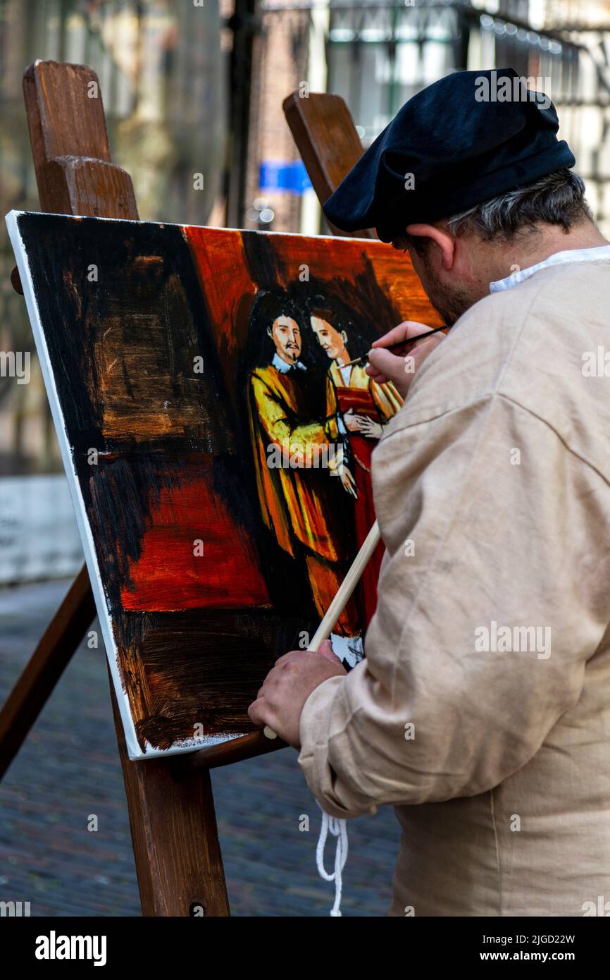 Reenactment festival of Rembrandt van Rijn, an actor painting the Jewish Bride, Leiden, South Holland, Netherlands. Stock Photo