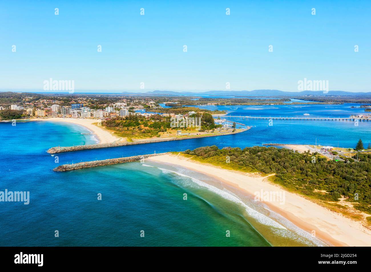 Entrance of Coolongolook river to Pacific ocean at Forster tuncurry towns in Australia - aerial view over beaches and waterfront. Stock Photo