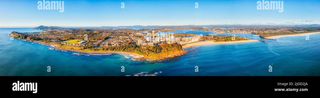 WIde aerial panorama of Forster Tuncurry towns coastal waterfront from Pacific ocean inland to Wallis lake and major area landmarks. Stock Photo