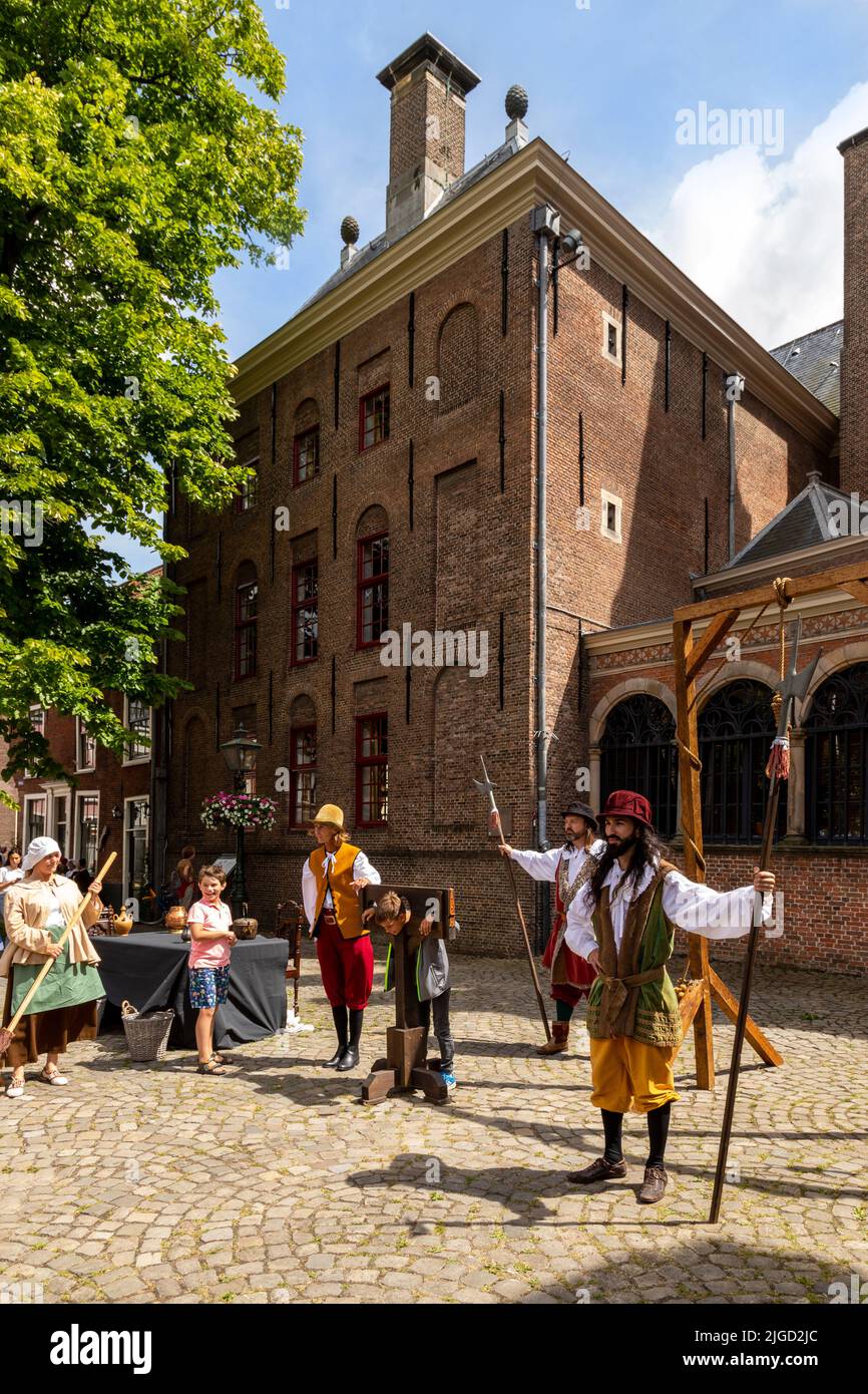 Rembrandt Reenactment festival- actors and public interacting at Gravensteen, a former prison and execution site, Leiden, South Holland, Netherlands. Stock Photo