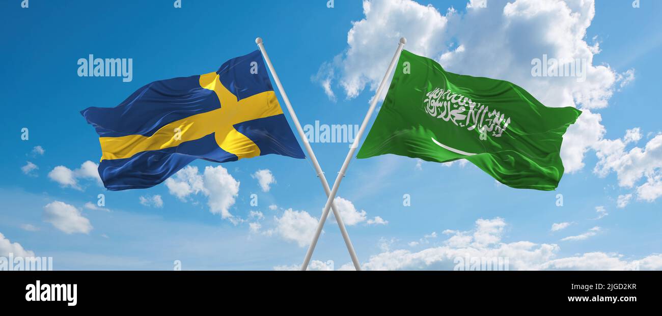 two crossed flags Saudi Arabia and Sweden waving in wind at cloudy sky ...