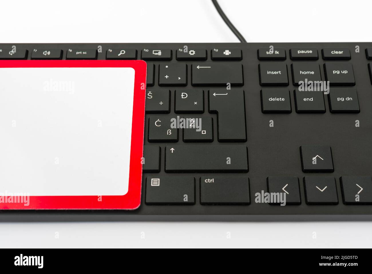 A top view of Computer Keyboard and note desk on a white background ...