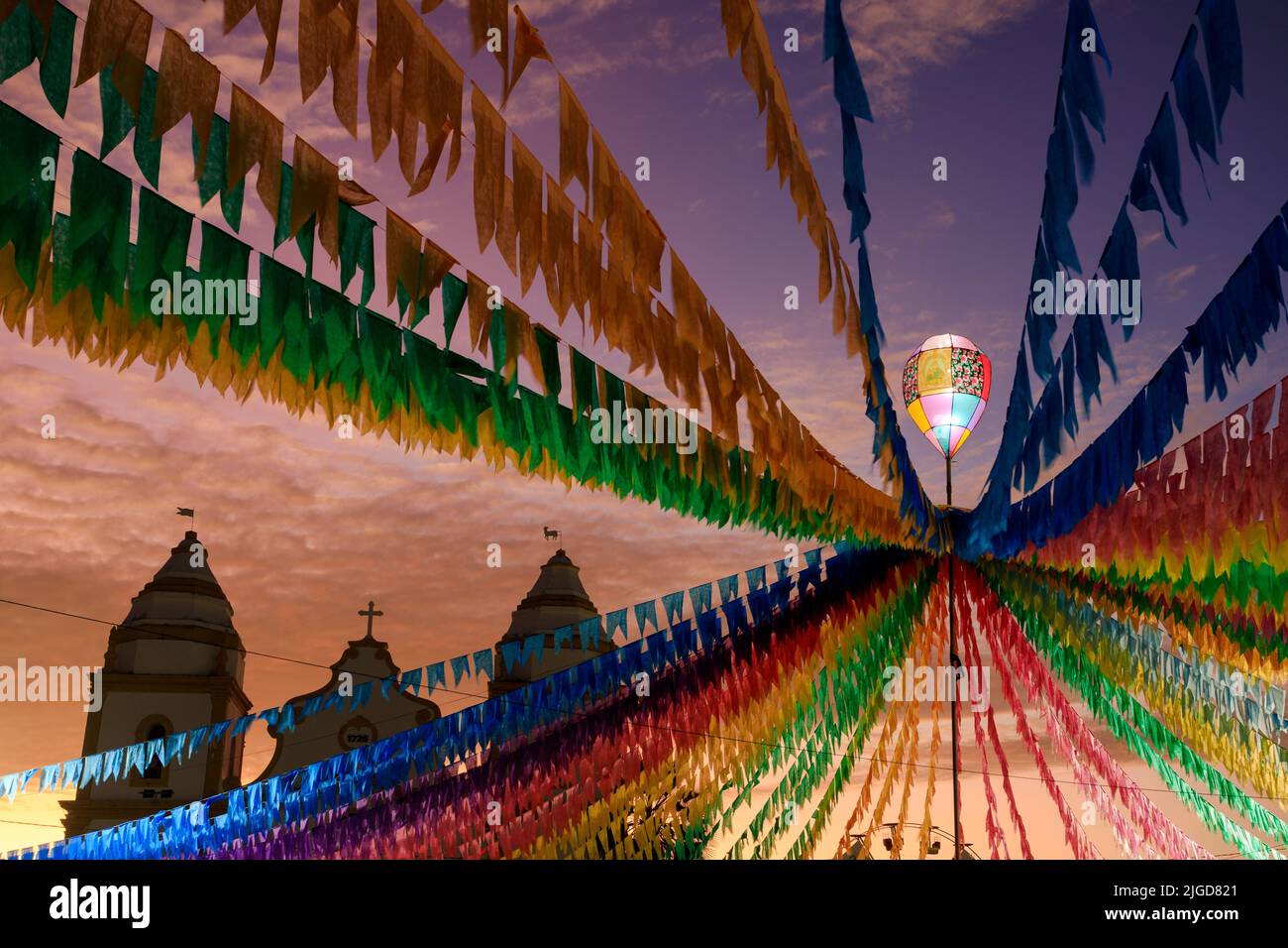 illuminated decorative balloon and colorful flags of the festa junina in Brazil Stock Photo