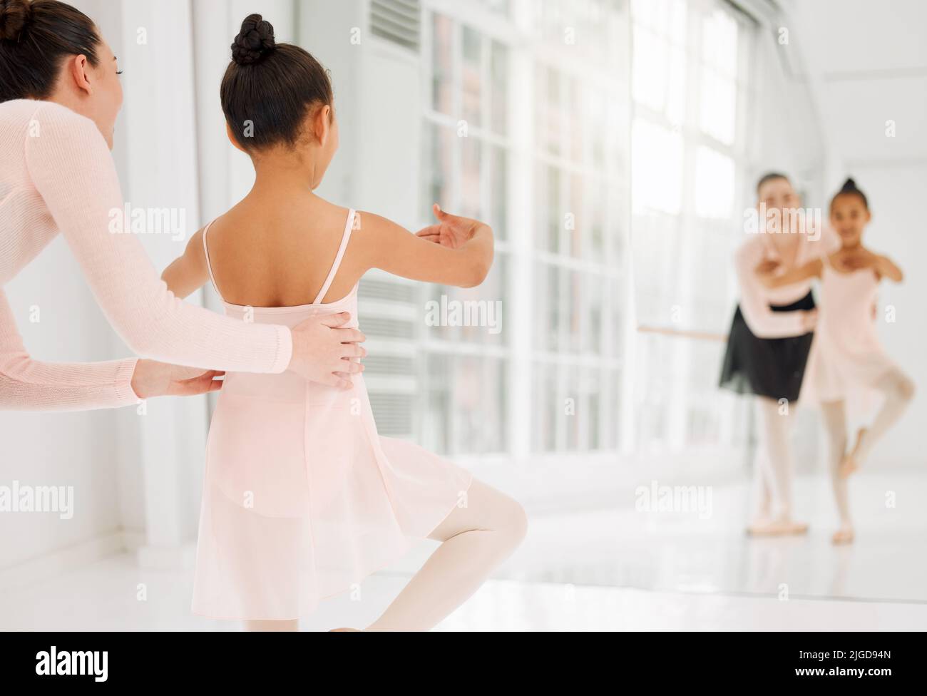 Your only competition is you. a little girl practicing ballet with her