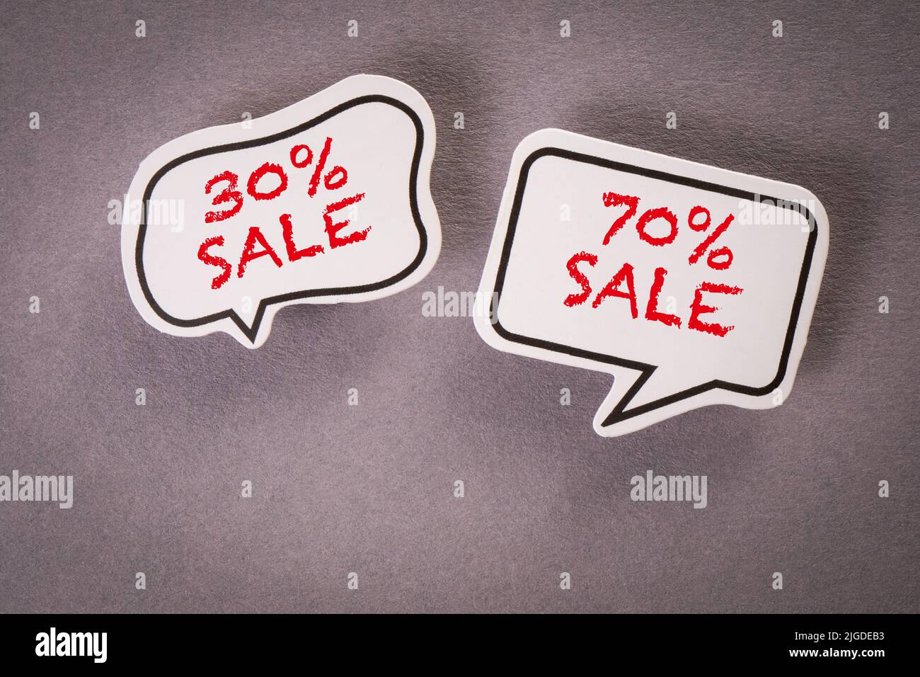 Shopping online. Two speech bubbles on a gray background. Stock Photo
