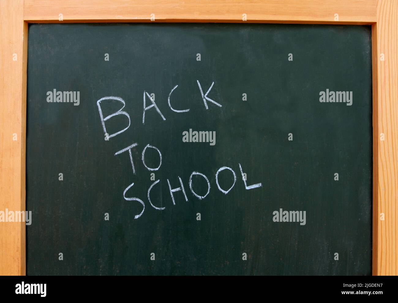 back to school written on a chalk board Stock Photo