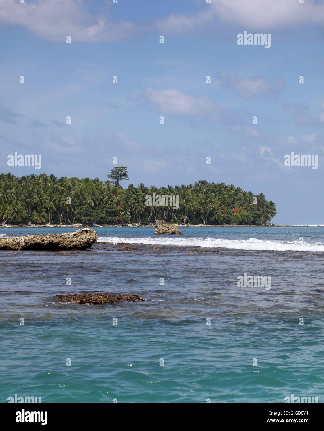 Tropical beach scene - Mentawai Islands Indonesia This remote area of Indonesia is home to some beautiful beaches and some of the best surf breaks in Stock Photo