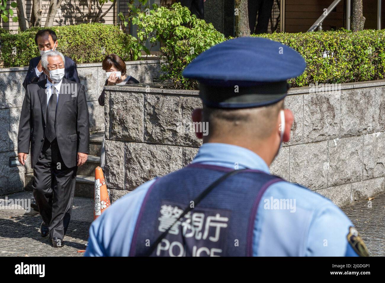 Tokyo, Japan. 09th July, 2022. Liberal Democratic Party (LDP) politicians leave after paying their respects, watched by police, outside the residence of former Japanese Prime Minister. Shinzo Abe was Japan's longest serving PM (2012-2020) and had been campaigning for his LDP party's candidates in the upcoming House of Councilors' election in the western city of Nara when he was shot and killed by a lone gunman on July 8th. Credit: SOPA Images Limited/Alamy Live News Stock Photo