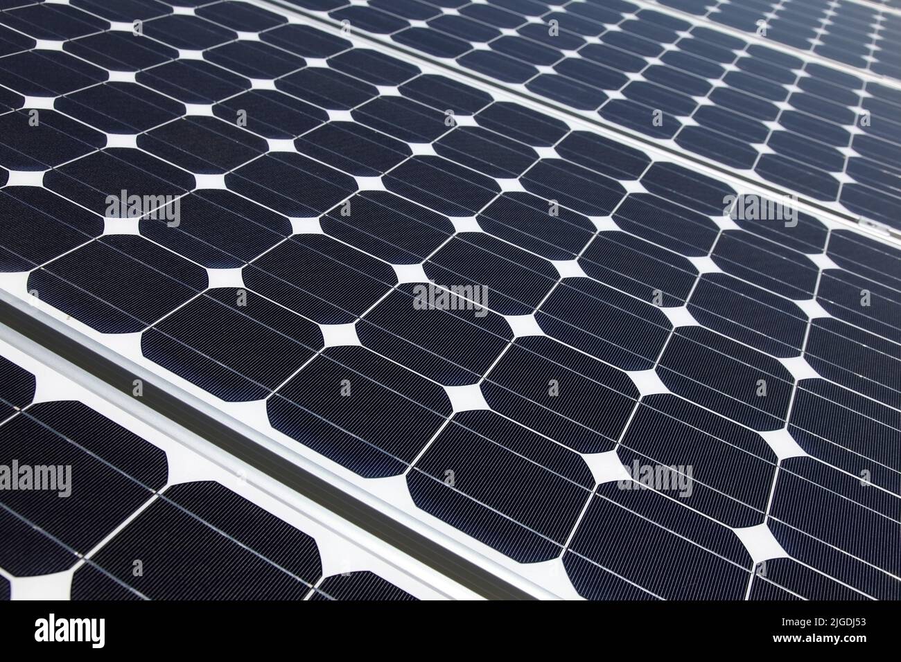 Closeup of solar panel cells mounted on roof top. Solar energy is becoming an important part of the energy mix. Stock Photo